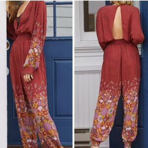 Anthropologie Rust Red bolo Floral open back long sleeved Jumpsuit